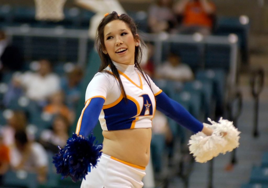 Mar 14, 2008; Katy, TX, USA; UT Arlington Mavericks cheerleader cheers on her team against the Sam Houston Bearkats in the second half of the Southland Conference Tournament at the Merrell Center. Mandatory Credit: Brett Davis-Imagn Images