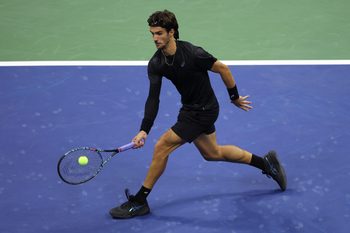 Sep 3, 2025; Flushing, NY, USA; Lorenzo Musetti (ITA) hits a shot against Jannik Sinner (ITA) (not pictured) on day eleven of the 2025 US Open tennis championships at USTA Billie Jean King National Tennis Center. Mandatory Credit: Mike Frey-Imagn Images