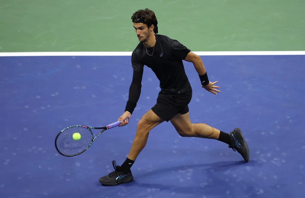 Sep 3, 2025; Flushing, NY, USA; Lorenzo Musetti (ITA) hits a shot against Jannik Sinner (ITA) (not pictured) on day eleven of the 2025 US Open tennis championships at USTA Billie Jean King National Tennis Center. Mandatory Credit: Mike Frey-Imagn Images