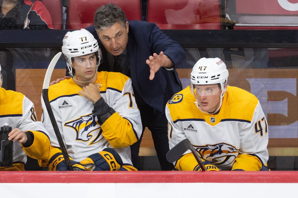 Oct 13, 2025; Ottawa, Ontario, CAN; Nashville Predators head coach Andrew Brunette coaches right wing Luke Evangelista (77) in the third period against the Ottawa Senators at the Canadian Tire Centre. Mandatory Credit: Marc DesRosiers-IMAGN Images