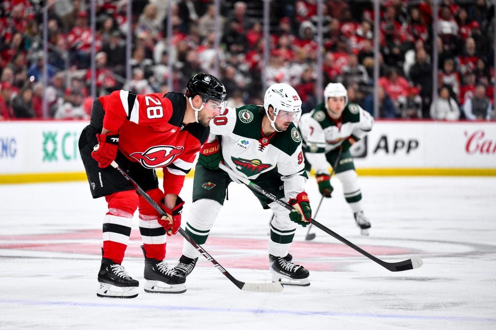 Oct 22, 2025; Newark, New Jersey, USA; New Jersey Devils right wing Timo Meier (28) and Minnesota Wild left wing Marcus Johansson (90) await a face off during the third period at Prudential Center. Mandatory Credit: John Jones-Imagn Images