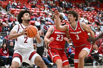 Oct 25, 2025; Pullman, WA, USA; Washington State Cougars forward Eemeli Yalaho (2) shoots the ball against New Mexico Lobos guard Jake Hall (23) in the second half at Friel Court at Beasley Coliseum. Mandatory Credit: James Snook-Imagn Images