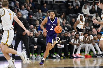 Nov 3, 2025; Providence, Rhode Island, USA; Holy Cross Crusaders guard Deandre Williams (2) dribbles the ball during the second half against the Providence Friars at Amica Mutual Pavilion. Mandatory Credit: Eric Canha-Imagn Images