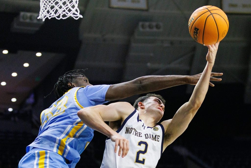 LIU forward Jamal Fuller, left, fouls Notre Dame guard Logan Imes (2) during a NCAA basketball game at Purcell Pavilion on Monday, Nov. 3, 2025, in South Bend.