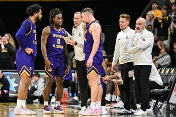 Nov 7, 2025; Iowa City, Iowa, USA; Western Illinois Leathernecks head coach Chad Boudreau (far right) reacts during a timeout with his coaches and guard Tyran Cook (0) and guard Lucas Lorenzen (3) and forward Isaiah Griffin (far left) during the first half against the Iowa Hawkeyes at Carver-Hawkeye Arena. Mandatory Credit: Jeffrey Becker-Imagn Images
