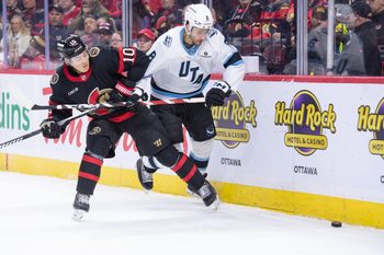 Nov 9, 2025; Ottawa, Ontario, CAN; Ottawa Senators defenseman Jordan Spence (10) battles with Utah Mammoth center Nick Schmaltz (8) in the second period at the Canadian Tire Centre. Mandatory Credit: Marc DesRosiers-IMAGN Images