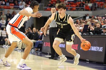 Nov 11, 2025; Auburn, Alabama, USA;  Auburn Tigers guard Elyjah Freeman (6) pressures Wofford Terriers forward Cannon Richards (7) during the first half at Neville Arena. Mandatory Credit: John Reed-Imagn Images