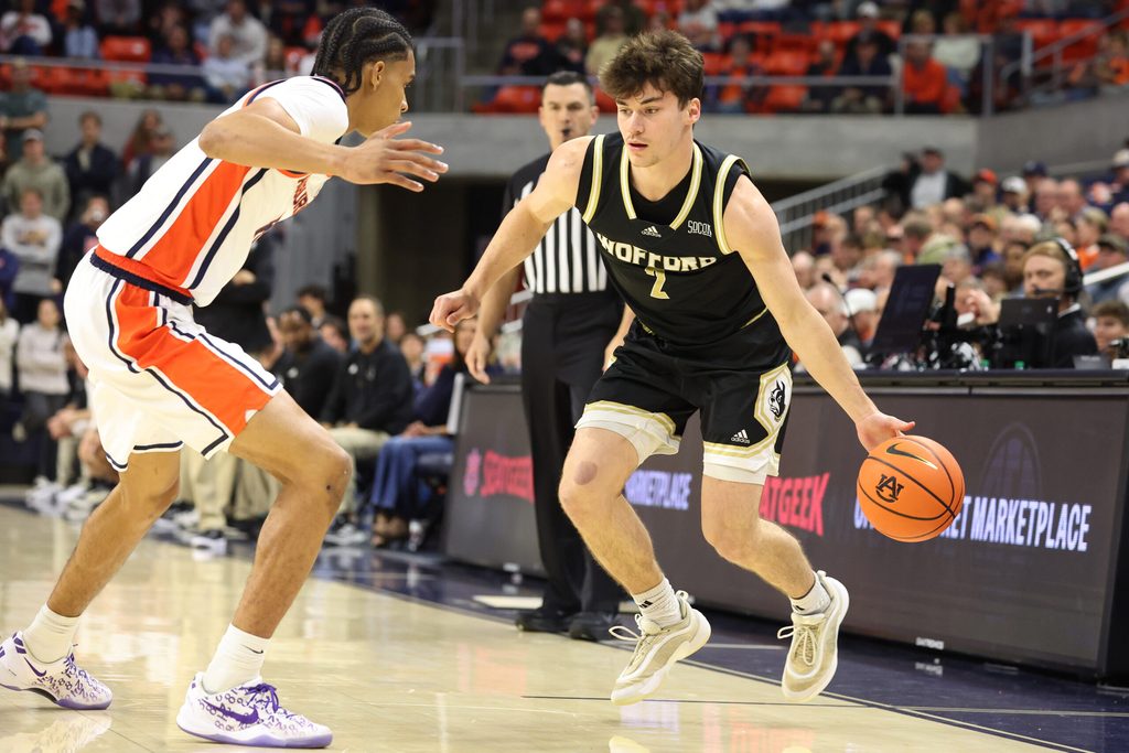 Nov 11, 2025; Auburn, Alabama, USA; Auburn Tigers guard Elyjah Freeman (6) pressures Wofford Terriers forward Cannon Richards (7) during the first half at Neville Arena. Mandatory Credit: John Reed-Imagn Images
