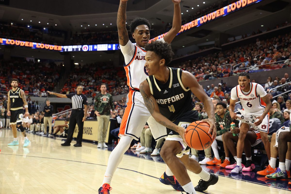 Nov 11, 2025; Auburn, Alabama, USA; Wofford Terriers guard Chace Watley (4) looks for help as Auburn Tigers guard Tahaad Pettiford (0) defends during the first half at Neville Arena. Mandatory Credit: John Reed-Imagn Images