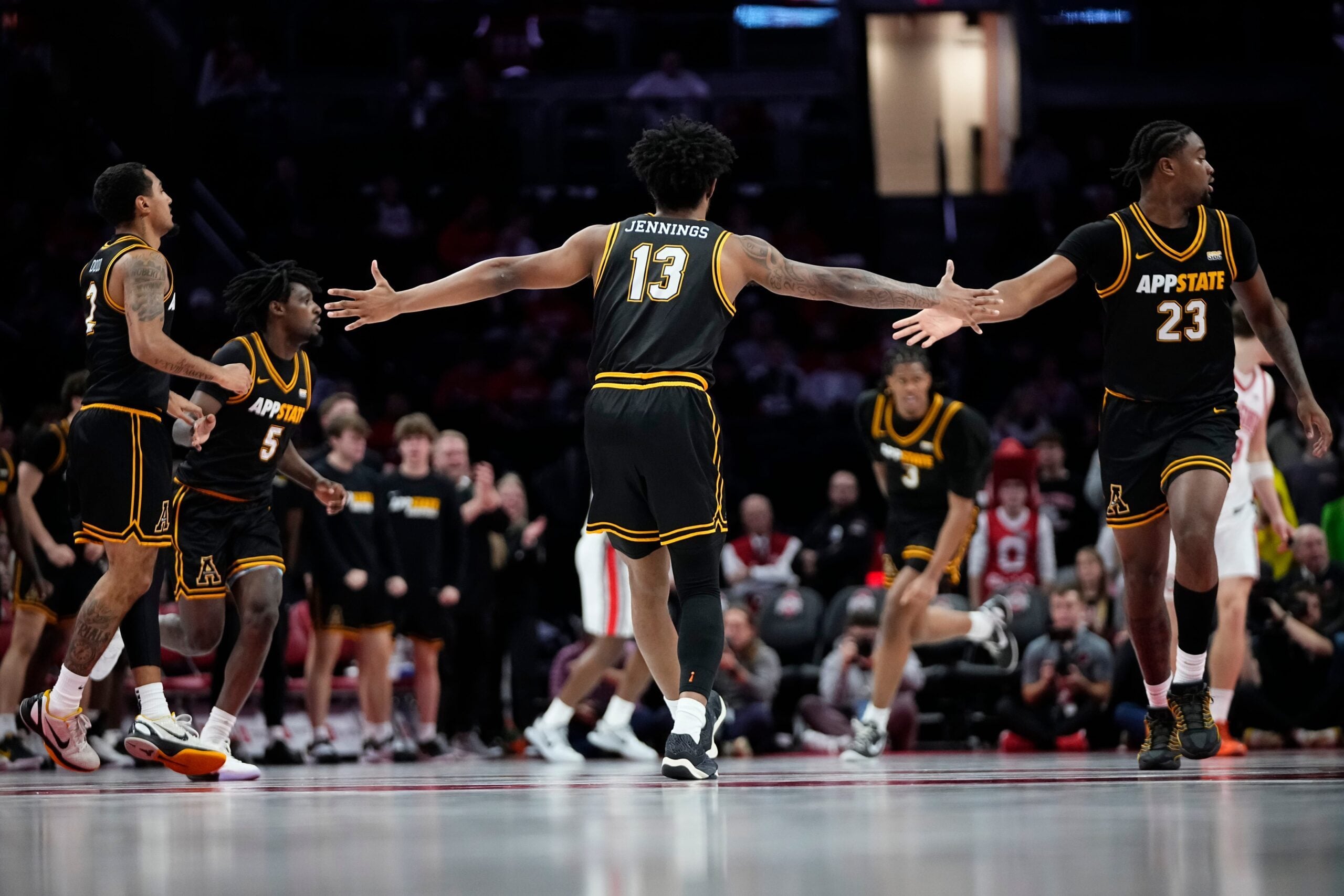 Appalachian State Mountaineers guard Kasen Jennings (13) celebrates a shot during the NCAA men's basketball game against the Ohio State Buckeyes at Value City Arena in Columbus on Nov. 11, 2025. Ohio State won 75-53.