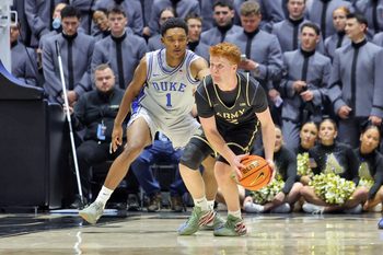 Nov 11, 2025; West Point, New York, USA; Army Black Knights guard Ryan Curry (2) is guarded by Duke Blue Devils guard Caleb Foster (1) during the second half at Christl Arena. Mandatory Credit: Danny Wild-Imagn Images