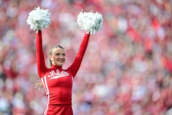 Nov 15, 2025; Bloomington, Indiana, USA; A Indiana Hoosiers cheerleader performs during a timeout in during the second quarter of the game against the Wisconsin Badgers at Memorial Stadium. Mandatory Credit: Marc Lebryk-Imagn Images