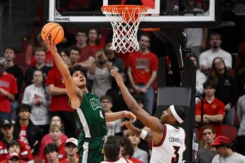 Nov 15, 2025; Louisville, Kentucky, USA;  Ohio Bobcats guard JJ Kelly (4) shoots against Louisville Cardinals guard Ryan Conwell (3) during the second half at KFC Yum! Center. Louisville defeated Ohio 106-81. Mandatory Credit: Jamie Rhodes-Imagn Images