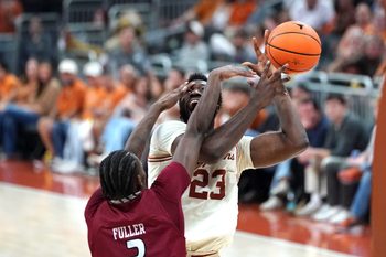 Nov 18, 2025; Austin, Texas, USA; Texas Longhorns forward Lassina Traore (23) is fouled by Rider Broncs forward Shemani Fuller (3) during the second half at Moody Center. Mandatory Credit: Dustin Safranek-Imagn Images