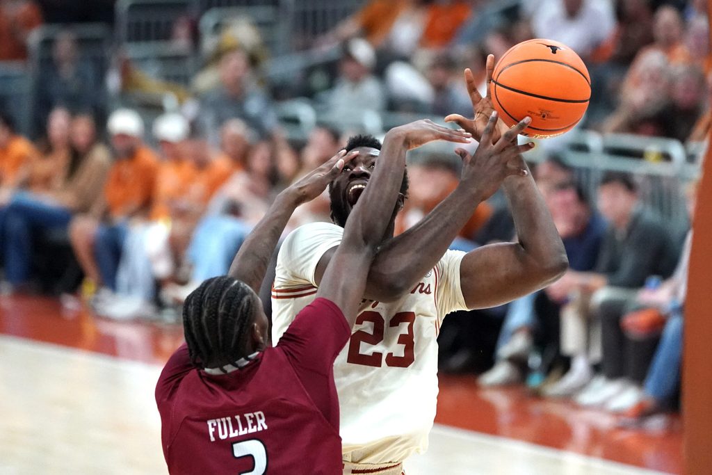 Nov 18, 2025; Austin, Texas, USA; Texas Longhorns forward Lassina Traore (23) is fouled by Rider Broncs forward Shemani Fuller (3) during the second half at Moody Center. Mandatory Credit: Dustin Safranek-Imagn Images