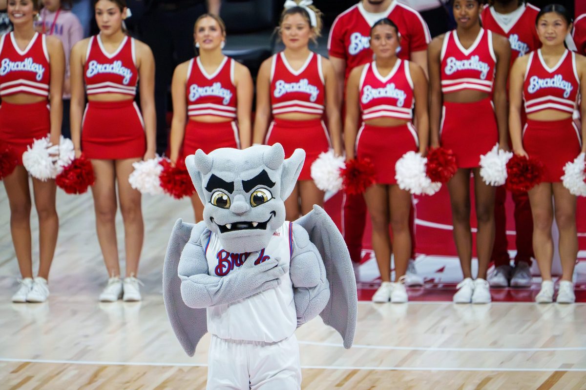 Bradley mascot Kaboom! stands with the cheerleaders for the national anthem before the start of their college basketball game against UMass Lowell on Wednesday, Nov. 19, 2025 at Carver Arena in Peoria. The Braves rallied to defeat the River Hawks 87-77.