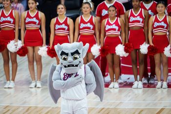Bradley mascot Kaboom! stands with the cheerleaders for the national anthem before the start of their college basketball game against UMass Lowell on Wednesday, Nov. 19, 2025 at Carver Arena in Peoria. The Braves rallied to defeat the River Hawks 87-77.