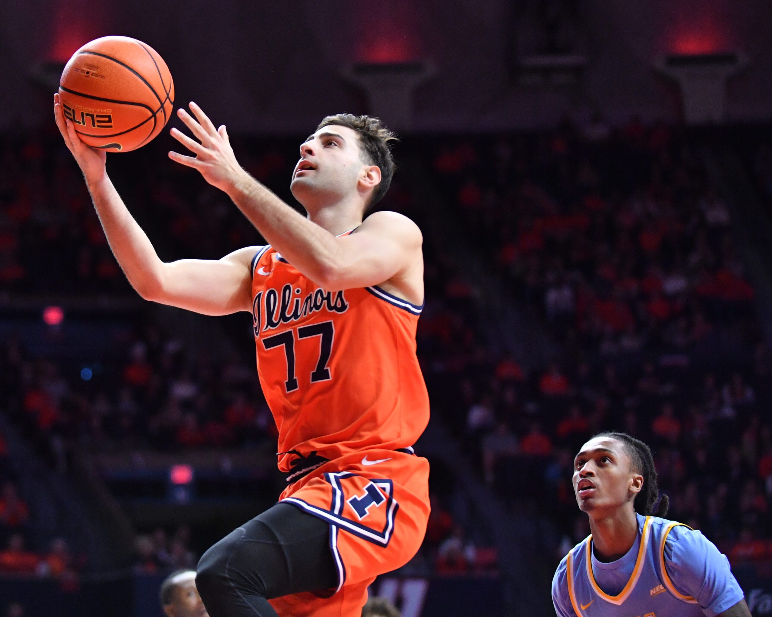 Nov 22, 2025; Champaign, Illinois, USA;  Illinois Fighting Illini guard Mihailo Petrovic (77) drives to the basket during the first half against the Long Island University Sharks at State Farm Center. Mandatory Credit: Ron Johnson-Imagn Images