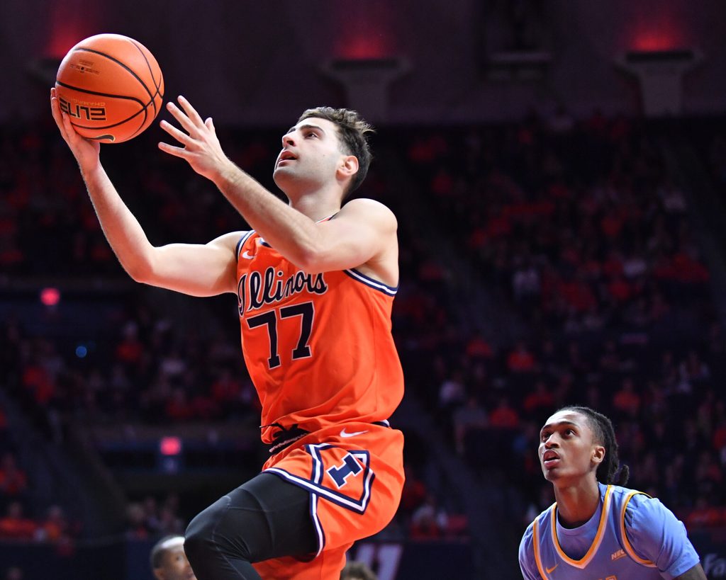 Nov 22, 2025; Champaign, Illinois, USA; Illinois Fighting Illini guard Mihailo Petrovic (77) drives to the basket during the first half against the Long Island University Sharks at State Farm Center. Mandatory Credit: Ron Johnson-Imagn Images