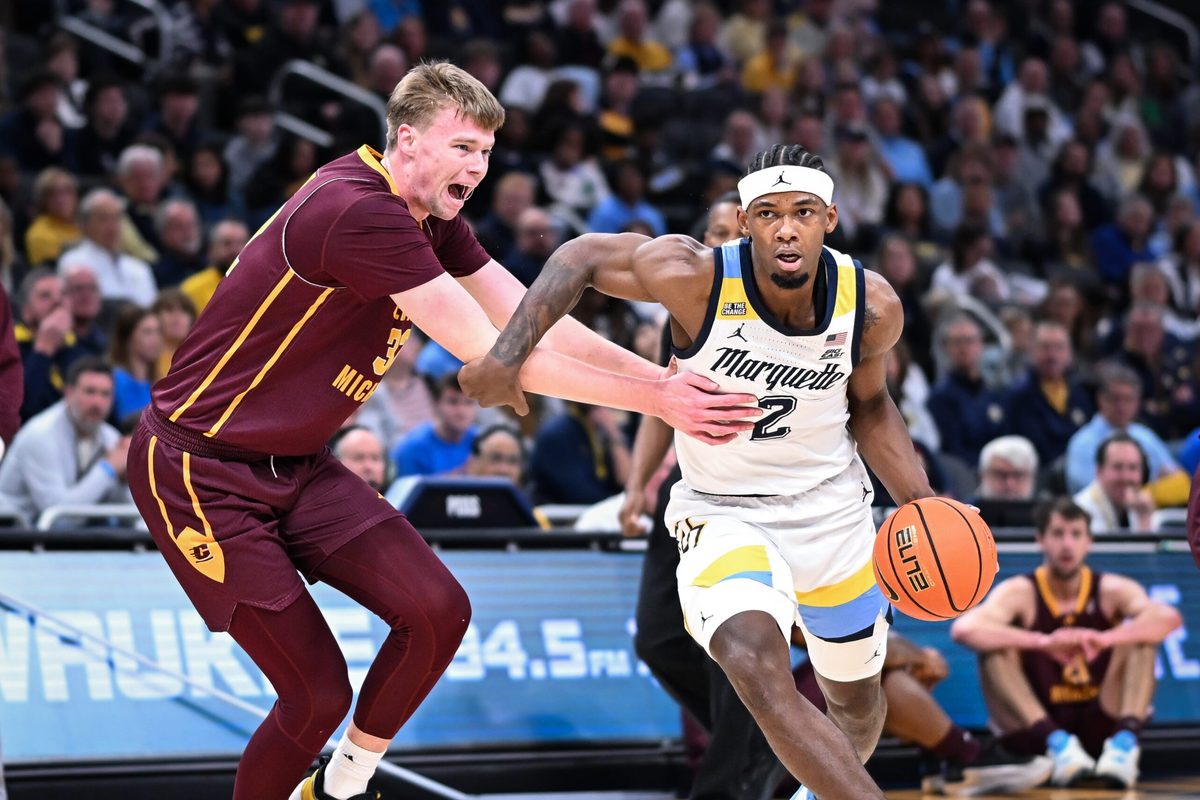 Marquette guard Chase Ross (2) goes to the basket past Central Michigan center Nathan Claerbaut (32) in the first half of a game Saturday, November 22, 2025, at Fiserv Forum in Milwaukee, Wisconsin.
