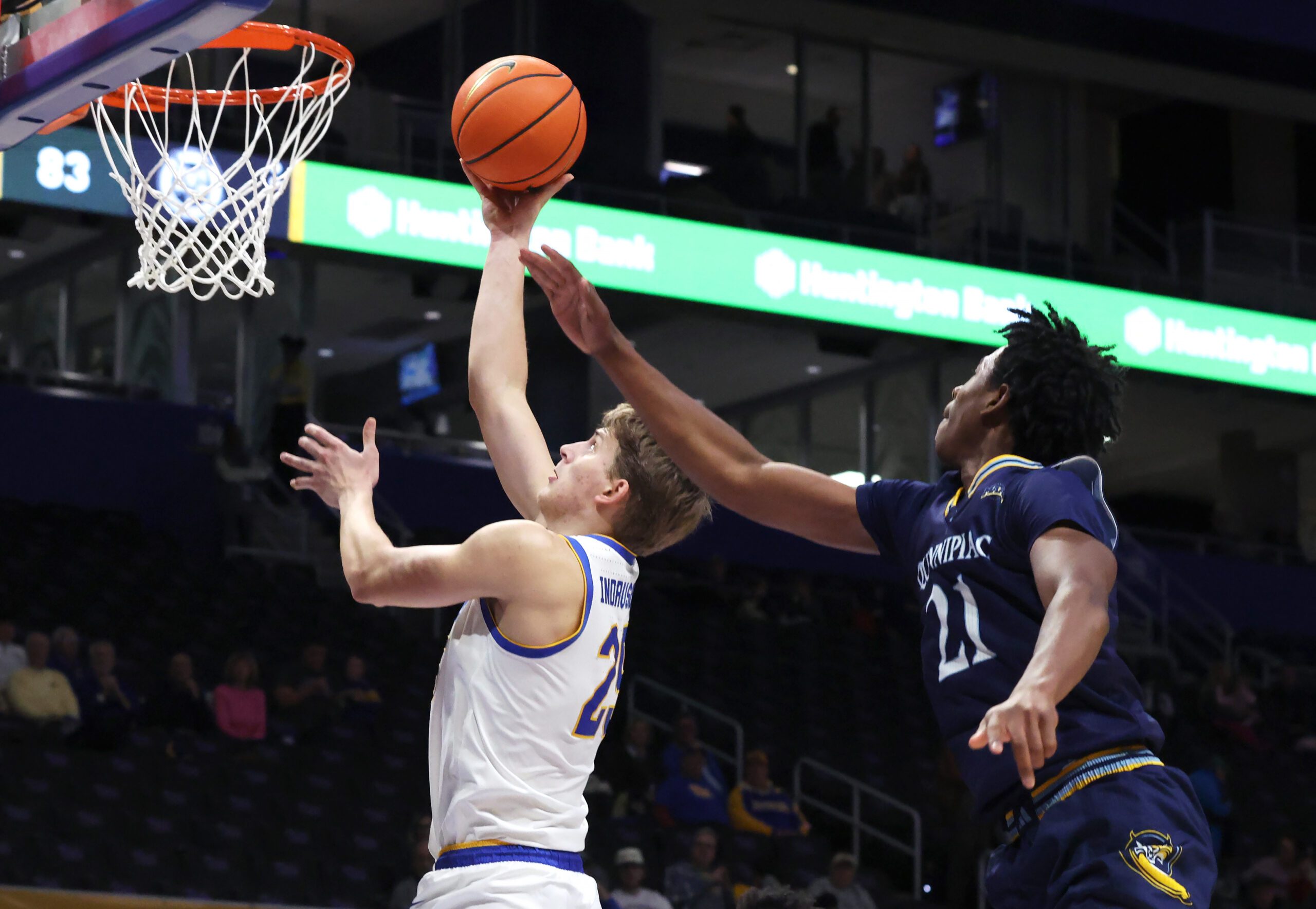 Nov 23, 2025; Pittsburgh, Pennsylvania, USA;  Pittsburgh Panthers guard Nojus Indrusaitis (25) shoots against Quinnipiac Bobcats guard Keith Mcknight (21) during the second half at the Petersen Events Center. Mandatory Credit: Charles LeClaire-Imagn Images