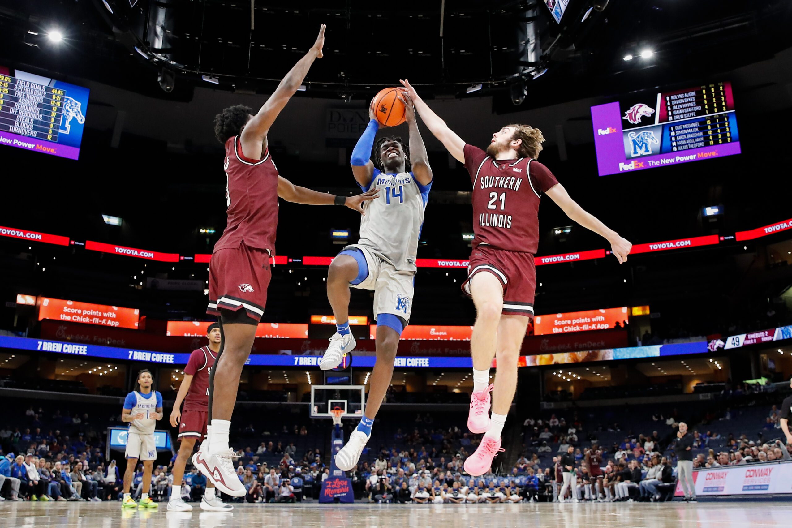 Nov 26, 2025; Memphis, Tennessee, USA; Memphis Tigers guard Hasan Abdul Hakim (14) shoots the ball against Southern Illinois Salukis guard Drew Steffe (21) during the second half at FedExForum. Mandatory Credit: Wesley Hale-Imagn Images
