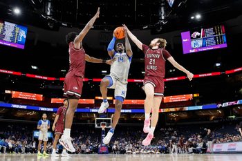 Nov 26, 2025; Memphis, Tennessee, USA; Memphis Tigers guard Hasan Abdul Hakim (14) shoots the ball against Southern Illinois Salukis guard Drew Steffe (21) during the second half at FedExForum. Mandatory Credit: Wesley Hale-Imagn Images