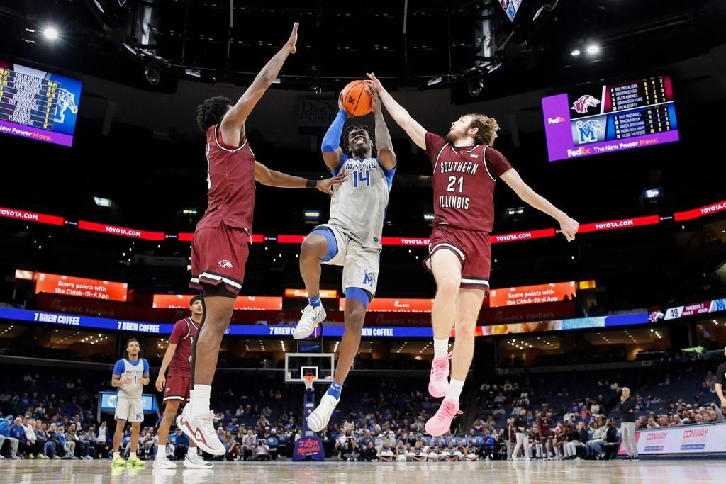 Nov 26, 2025; Memphis, Tennessee, USA; Memphis Tigers guard Hasan Abdul Hakim (14) shoots the ball against Southern Illinois Salukis guard Drew Steffe (21) during the second half at FedExForum. Mandatory Credit: Wesley Hale-Imagn Images