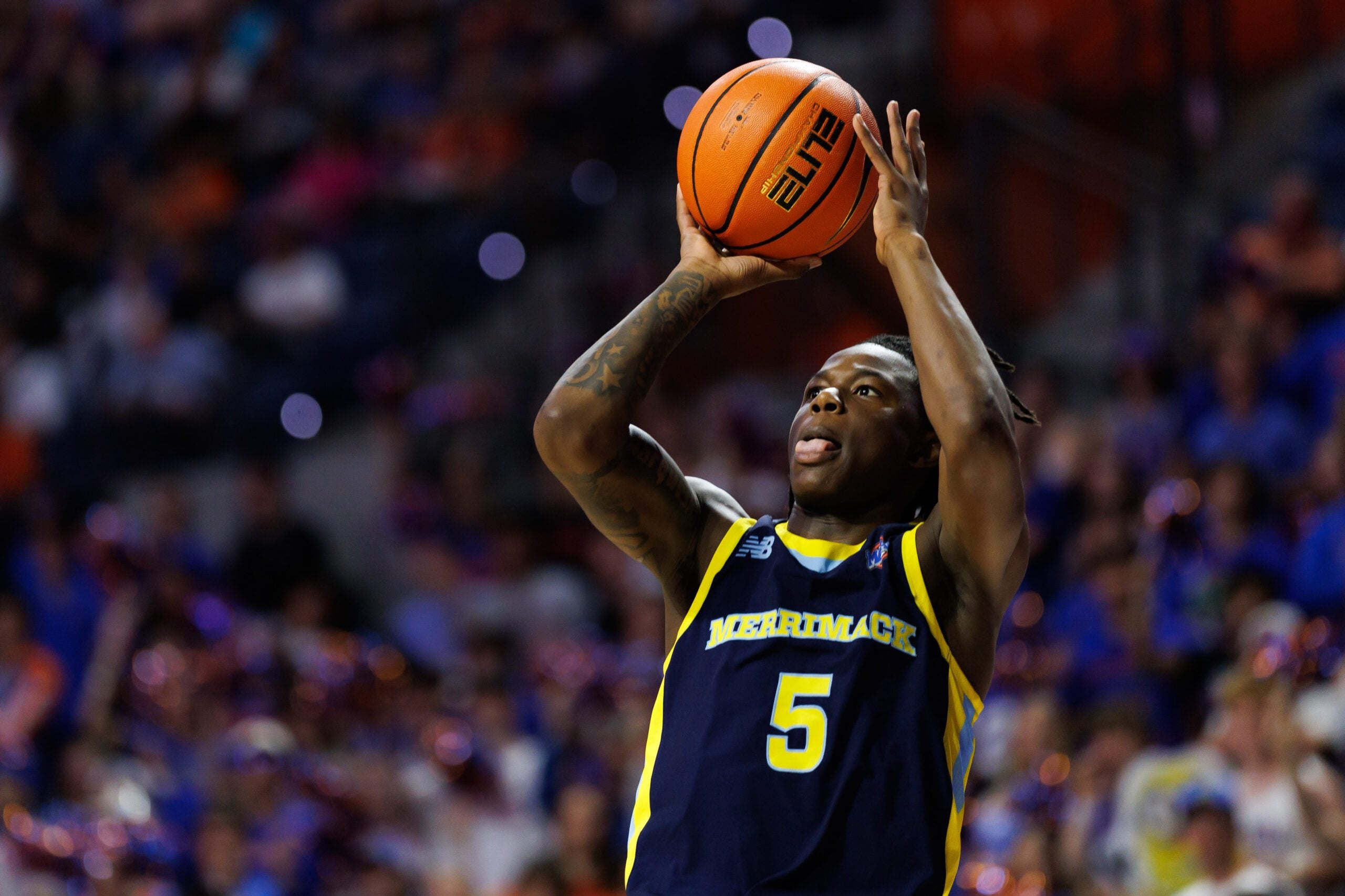 Nov 21, 2025; Gainesville, Florida, USA; Merrimack Warriors guard Kevair Kennedy (5) shoots the ball against the Florida Gators during the first half at Exactech Arena at the Stephen C. O'Connell Center. Mandatory Credit: Matt Pendleton-Imagn Images