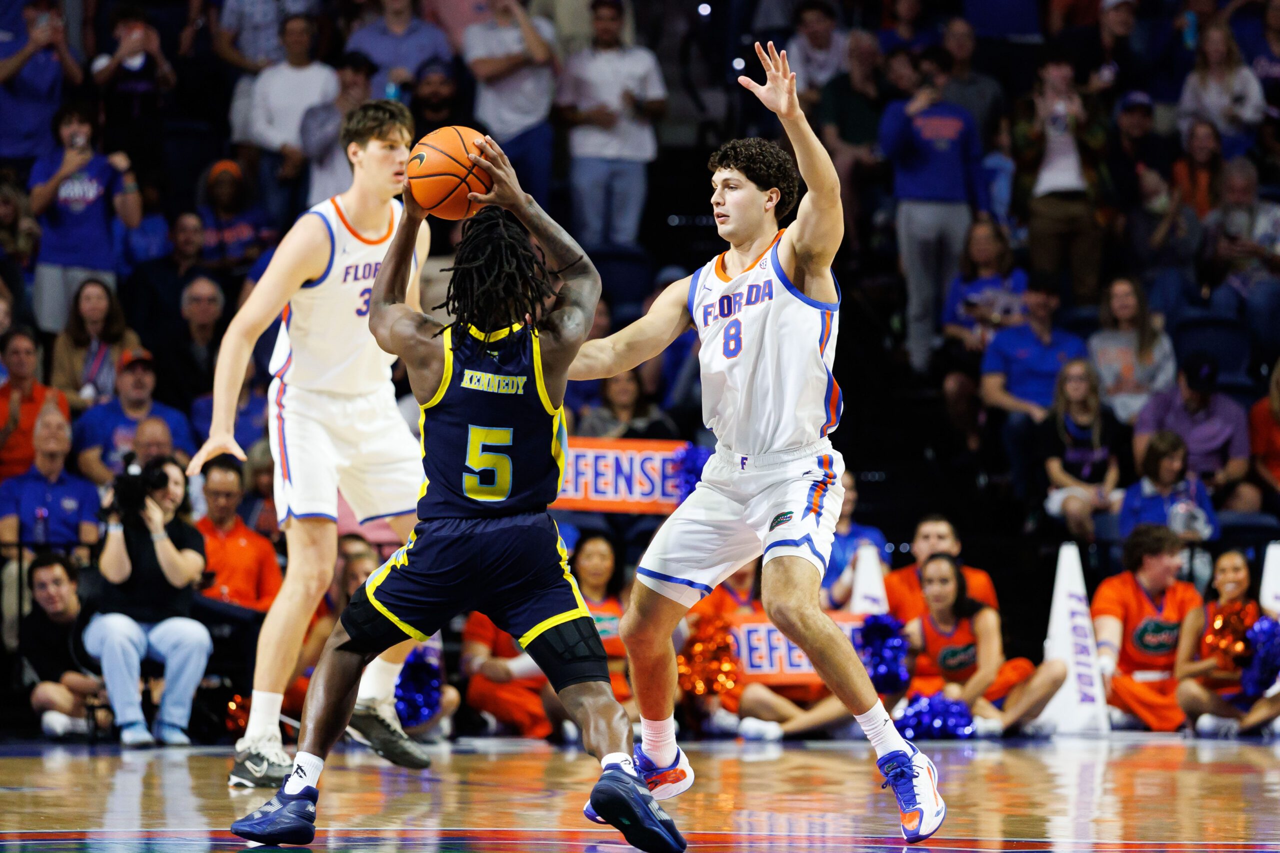 Nov 21, 2025; Gainesville, Florida, USA; Florida Gators guard Alex Kovatchev (8) defends Merrimack Warriors guard Kevair Kennedy (5) during the second half at Exactech Arena at the Stephen C. O'Connell Center. Mandatory Credit: Matt Pendleton-Imagn Images