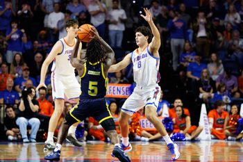 Nov 21, 2025; Gainesville, Florida, USA; Florida Gators guard Alex Kovatchev (8) defends Merrimack Warriors guard Kevair Kennedy (5) during the second half at Exactech Arena at the Stephen C. O'Connell Center. Mandatory Credit: Matt Pendleton-Imagn Images