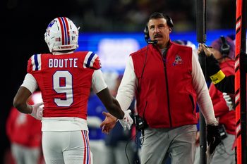 Dec 1, 2025; Foxborough, Massachusetts, USA; New England Patriots wide receiver Kayshon Boutte (9) high-fives New England Patriots head coach Mike Vrabel on the sideline during the third quarter at Gillette Stadium. Mandatory Credit: David Butler II-Imagn Images