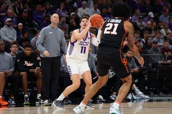 Dec 6, 2025; Phoenix, Arizona, USA; Grand Canyon Lopes guard Caleb Shaw (11) attempts a 3-point shot against the Oklahoma State Cowboys at PHX Arena. Mandatory Credit: Anna Carrington-Imagn Images