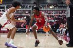 Dec 7, 2025; Stanford, California, USA;  UNLV Runnin' Rebels forward Kimani Hamilton (2) dribbles against Stanford Cardinal guard Ryan Agarwal (11) in the second half at Maples Pavilion. Mandatory Credit: David Gonzales-Imagn Images
