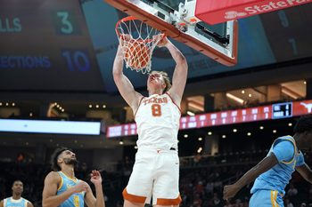 Dec 8, 2025; Austin, Texas, USA;  Texas Longhorns center Matas Vokietaitis (8) dunks the ball against Southern University Jaguars forward Malek Abdelgowad (8) during the first half at Moody Center. Mandatory Credit: Dustin Safranek-Imagn Images