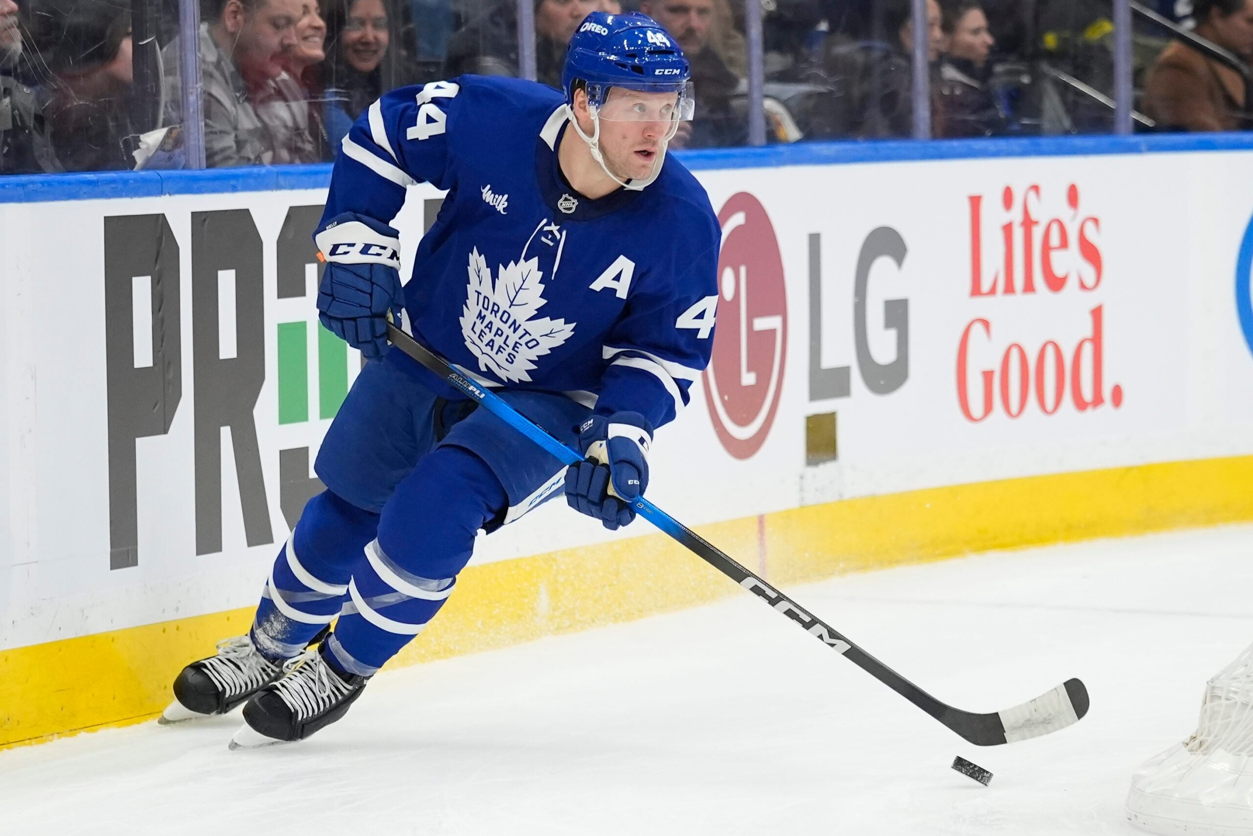 Dec 8, 2025; Toronto, Ontario, CAN; Toronto Maple Leafs defenseman Morgan Rielly (44) carries th epuck against the Tampa Bay Lightning during the second period at Scotiabank Arena. Mandatory Credit: John E. Sokolowski-Imagn Images