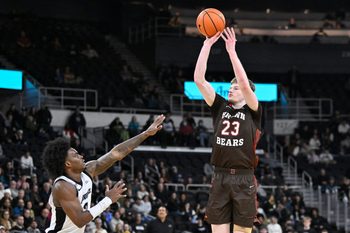 Dec 9, 2025; Providence, Rhode Island, USA; Brown Bears guard David Rochester (23) shoots the ball over Providence Friars guard Jaylin Sellers (2) during the second half at Amica Mutual Pavilion. Mandatory Credit: Eric Canha-Imagn Images