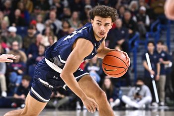 Dec 7, 2025; Spokane, Washington, USA; North Florida Ospreys guard Kamrin Oriol (11) controls the ball against the Gonzaga Bulldogs in the first half at McCarthey Athletic Center. Mandatory Credit: James Snook-Imagn Images