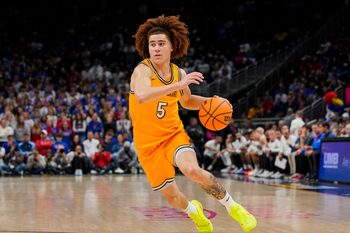 Dec 7, 2025; Kansas City, Missouri, USA; Missouri Tigers guard T.O. Barrett (5) dribbles the ball during the second half against the Kansas Jayhawks at T-Mobile Center. Mandatory Credit: Jay Biggerstaff-Imagn Images