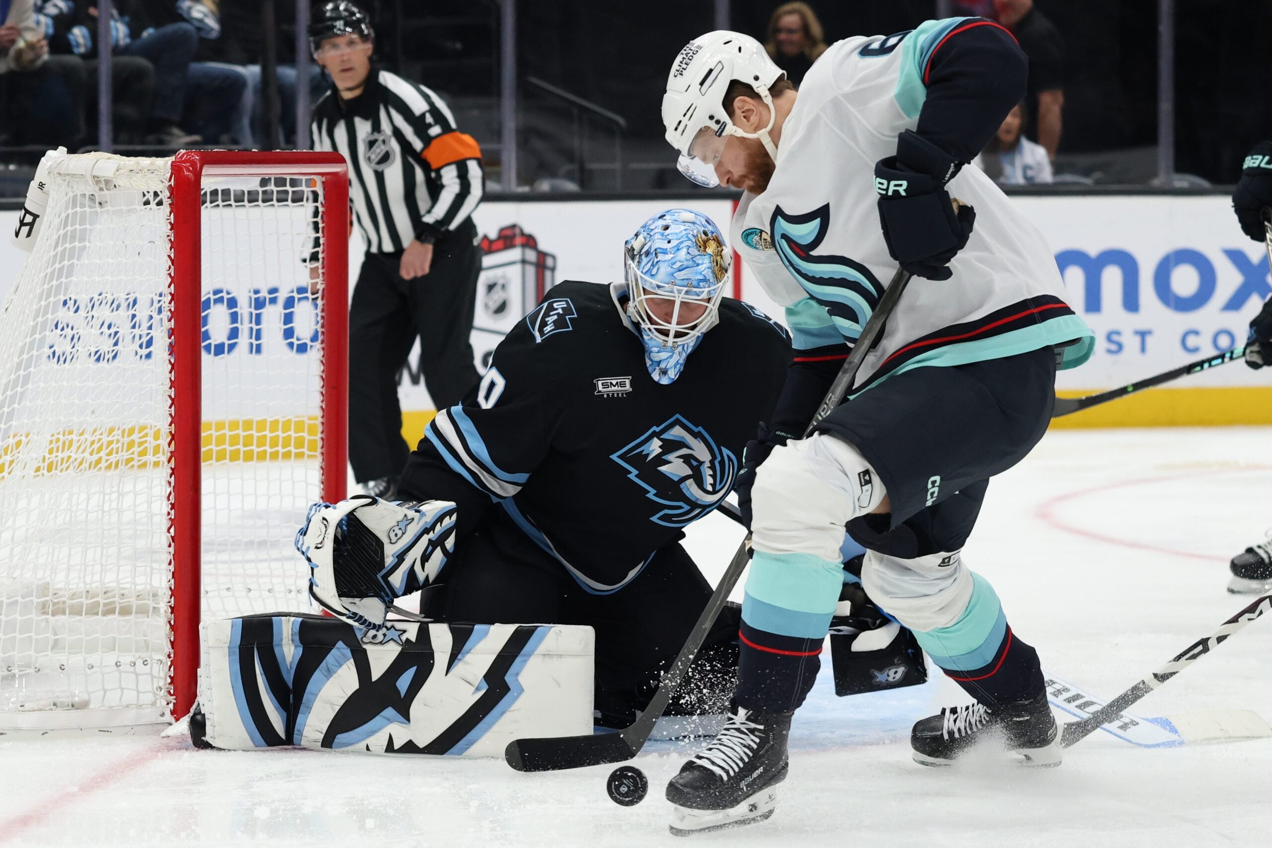 Dec 12, 2025; Salt Lake City, Utah, USA; Seattle Kraken defenseman Adam Larsson (6) plays the puck against Utah Mammoth goaltender Karel Vejmelka (70) during the third period at Delta Center. Mandatory Credit: Rob Gray-Imagn Images