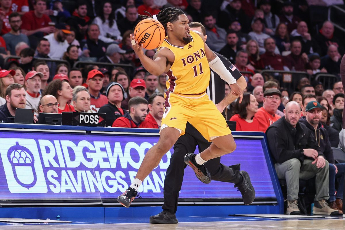 Dec 13, 2025; Queens, New York, USA; Iona Gaels guard C.J. Anthony (11) leaps trying to avoid a backcourt violation in the second half against the St. John's Red Storm at Madison Square Garden. Mandatory Credit: Wendell Cruz-Imagn Images