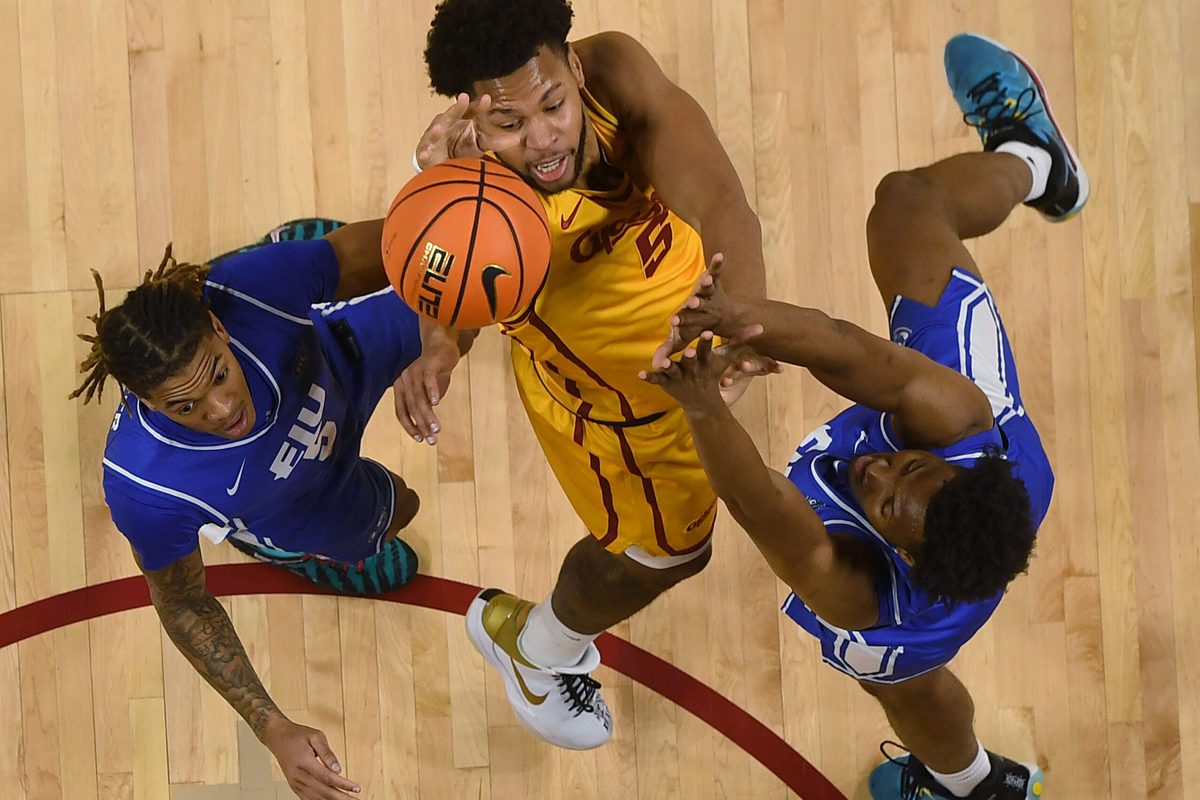Iowa State Cyclones forward Joshua Jefferson (5) shoots the ball over the ball between Eastern Illinois Panthers guard Zion Fruster (5) and forward Naz Fisher (13) during the second half on December 14, 2025, at Hilton Coliseum in Ames, Iowa.