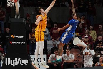 Iowa State Cyclones forward Blake Buchanan (23) attempts to block the ball as Eastern Illinois Panthers guard Zion Fruster (5) shoots during the second half on December 14, 2025, at Hilton Coliseum in Ames, Iowa.