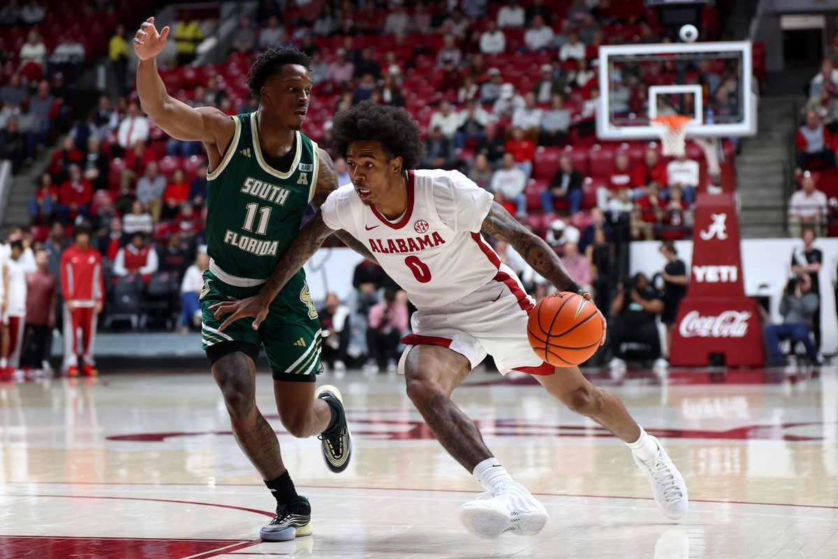 Dec 17, 2025; Tuscaloosa, Alabama, USA; Alabama Crimson Tide guard Labaron Philon (0) dribbles against South Florida Bulls guard CJ Brown (11) during the first half at Coleman Coliseum. Mandatory Credit: David Leong-Imagn Images