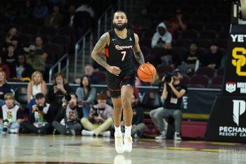 Dec 17, 2025; Los Angeles, California, USA; UTSA Roadrunners guard Jamir Simpson (7) dribbles the ball against the Southern California Trojans in the second half at Galen Center. Mandatory Credit: Kirby Lee-Imagn Images