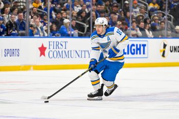 Dec 18, 2025; St. Louis, Missouri, USA; St. Louis Blues center Robert Thomas (18) controls the puck against the New York Rangers during the second period at Enterprise Center. Mandatory Credit: Jeff Curry-Imagn Images