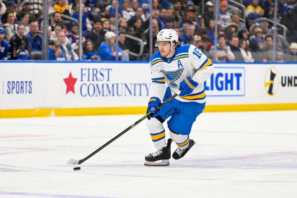 Dec 18, 2025; St. Louis, Missouri, USA; St. Louis Blues center Robert Thomas (18) controls the puck against the New York Rangers during the second period at Enterprise Center. Mandatory Credit: Jeff Curry-Imagn Images