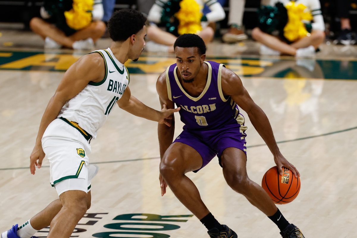 Dec 19, 2025; Waco, Texas, USA; Alcorn State Braves guard Shane Lancaster (0) controls the ball against Baylor Bears guard Isaac Williams (10) during the first half at Paul and Alejandra Foster Pavilion. Mandatory Credit: Chris Jones-Imagn Images