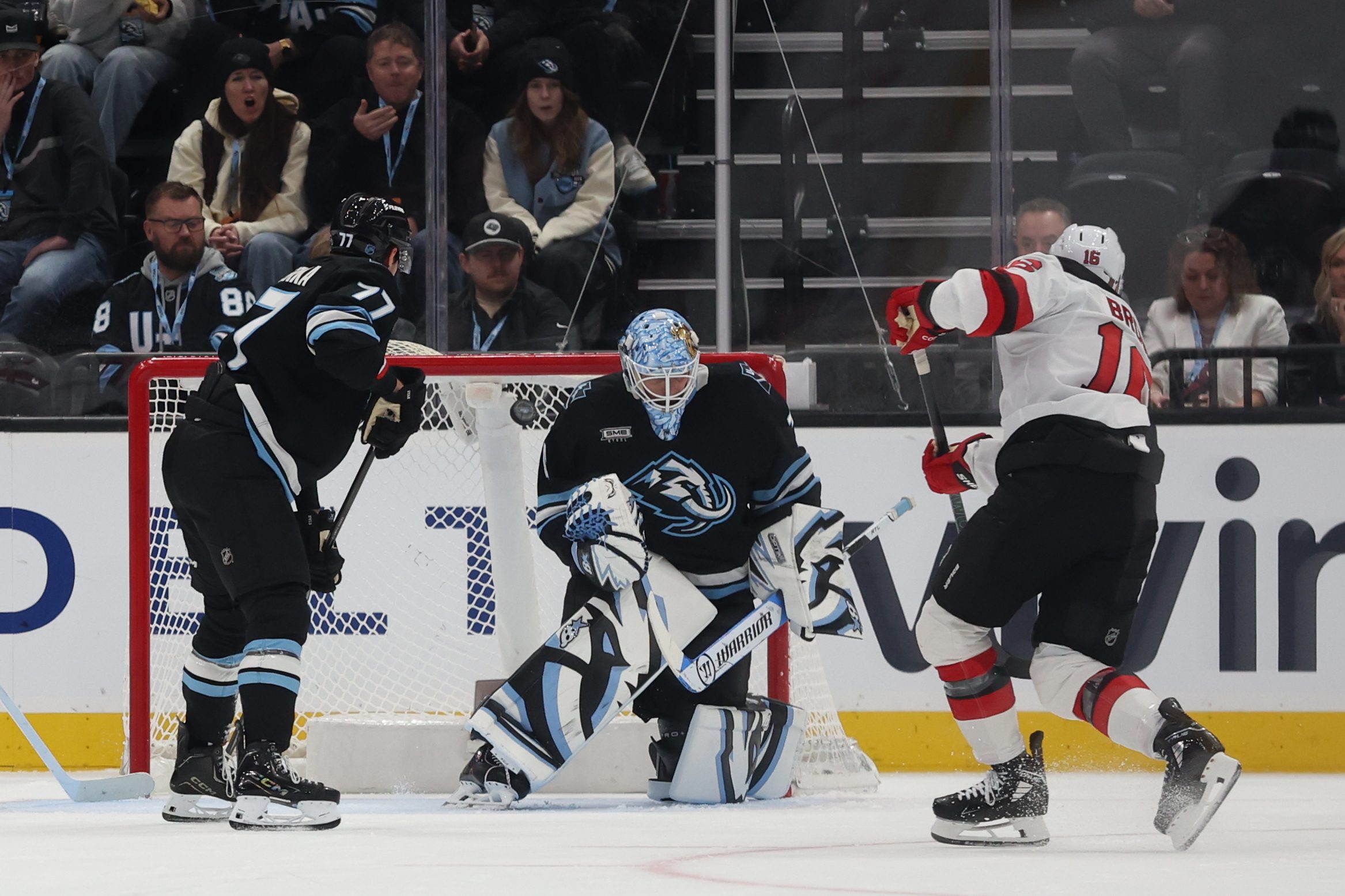 Dec 19, 2025; Salt Lake City, Utah, USA; New Jersey Devils right wing Connor Brown (16) scores a goal against Utah Mammoth goaltender Karel Vejmelka (70) during the second period at Delta Center. Mandatory Credit: Rob Gray-Imagn Images