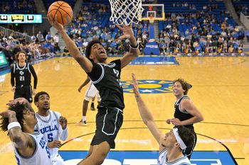 Dec 19, 2025; Los Angeles, California, USA; Cal Poly Mustangs guard Cayden Ward (14) goes up for a basket during the second half against the UCLA Bruins at Pauley Pavilion presented by Wescom Financial. Mandatory Credit: Jayne Kamin-Oncea-Imagn Images